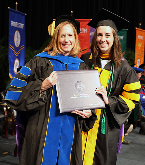 parent presents diploma